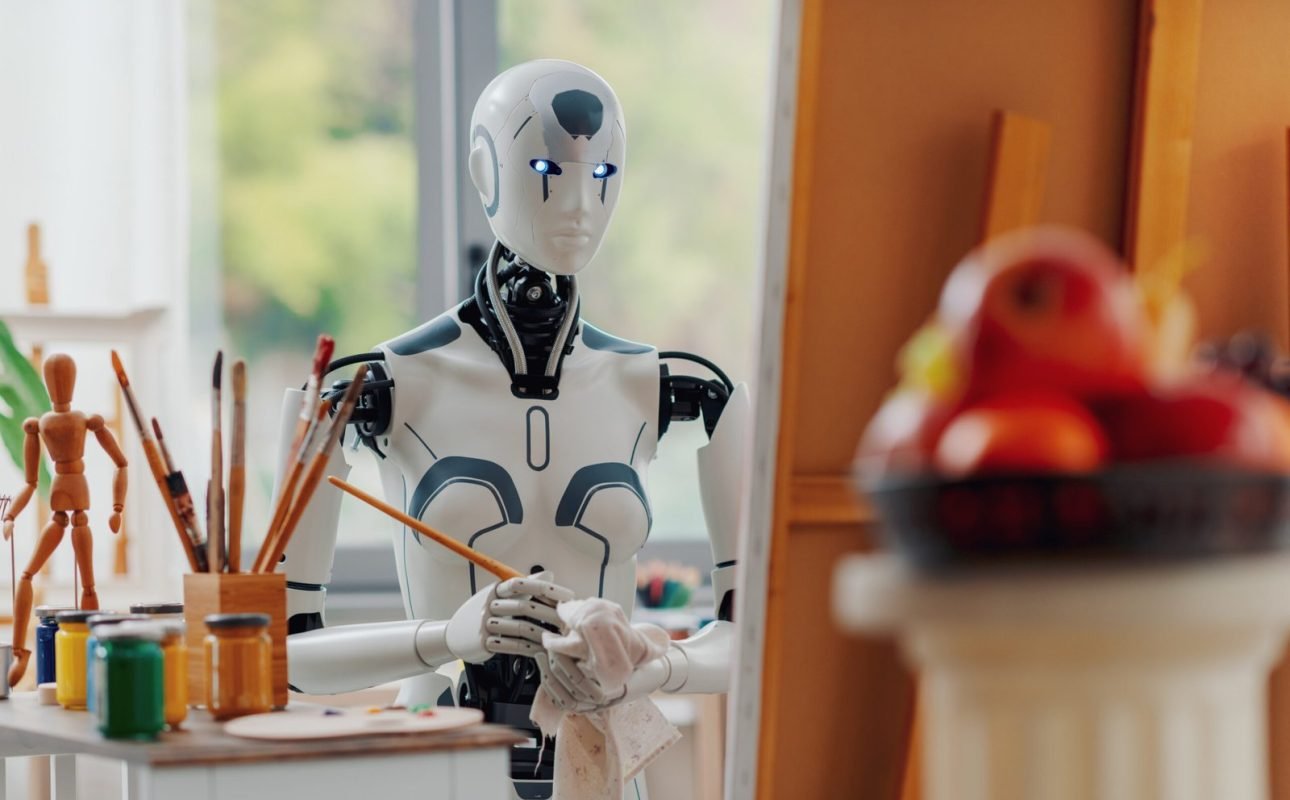 Humanoid AI robot painting on canvas